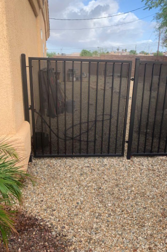 Vertical-bar yard fence with slider